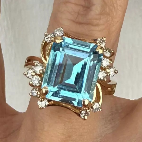 8.42ctw Emerald Cut Blue Topaz Cocktail Ring