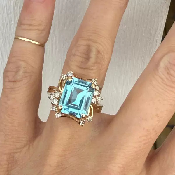 8.42ctw Emerald Cut Blue Topaz Cocktail Ring