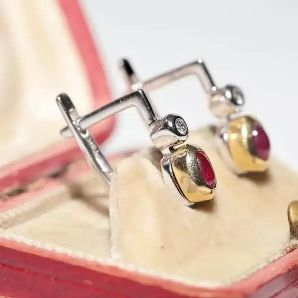 Two Tone 3ctw Oval Cut Ruby And White Sapphire Earrings